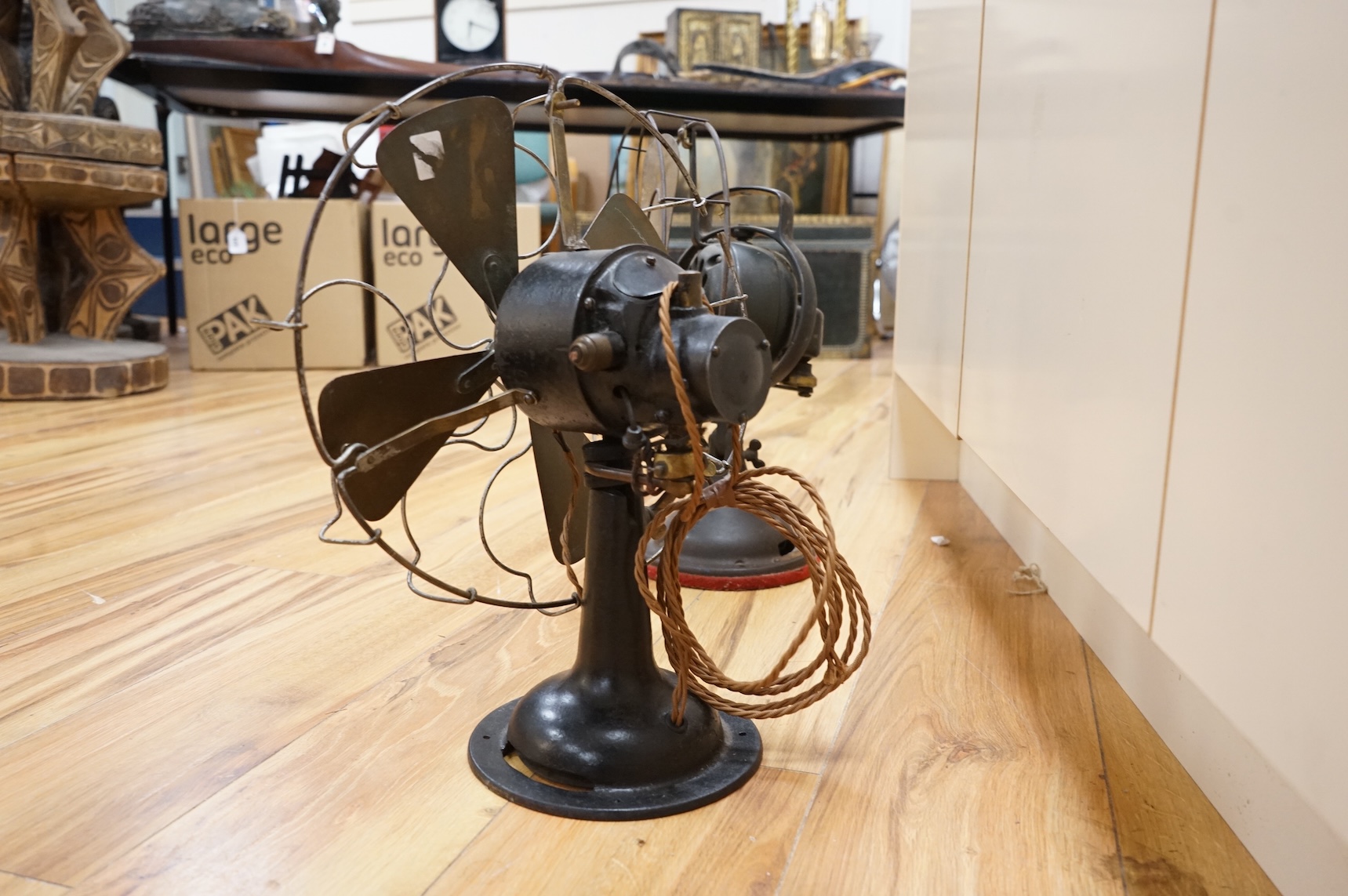 Two early 20th century electric fans, one by General Electric, 43cm high